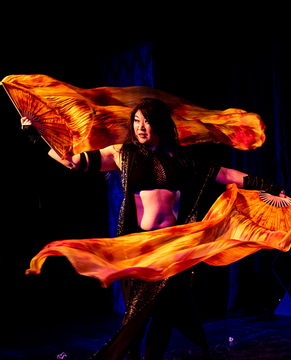 Dawn Xiana Moon with fan veils onstage